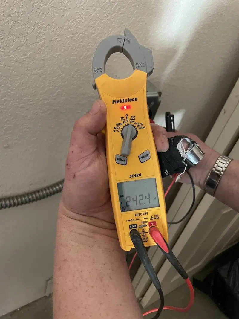 Voltage testing with clamp meter during Electrical Installation Services in La Grange